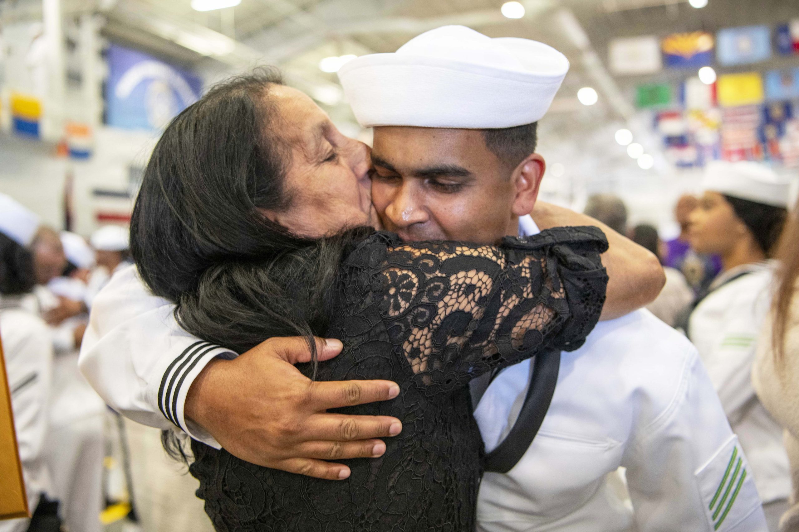 Service members sharing an embrace